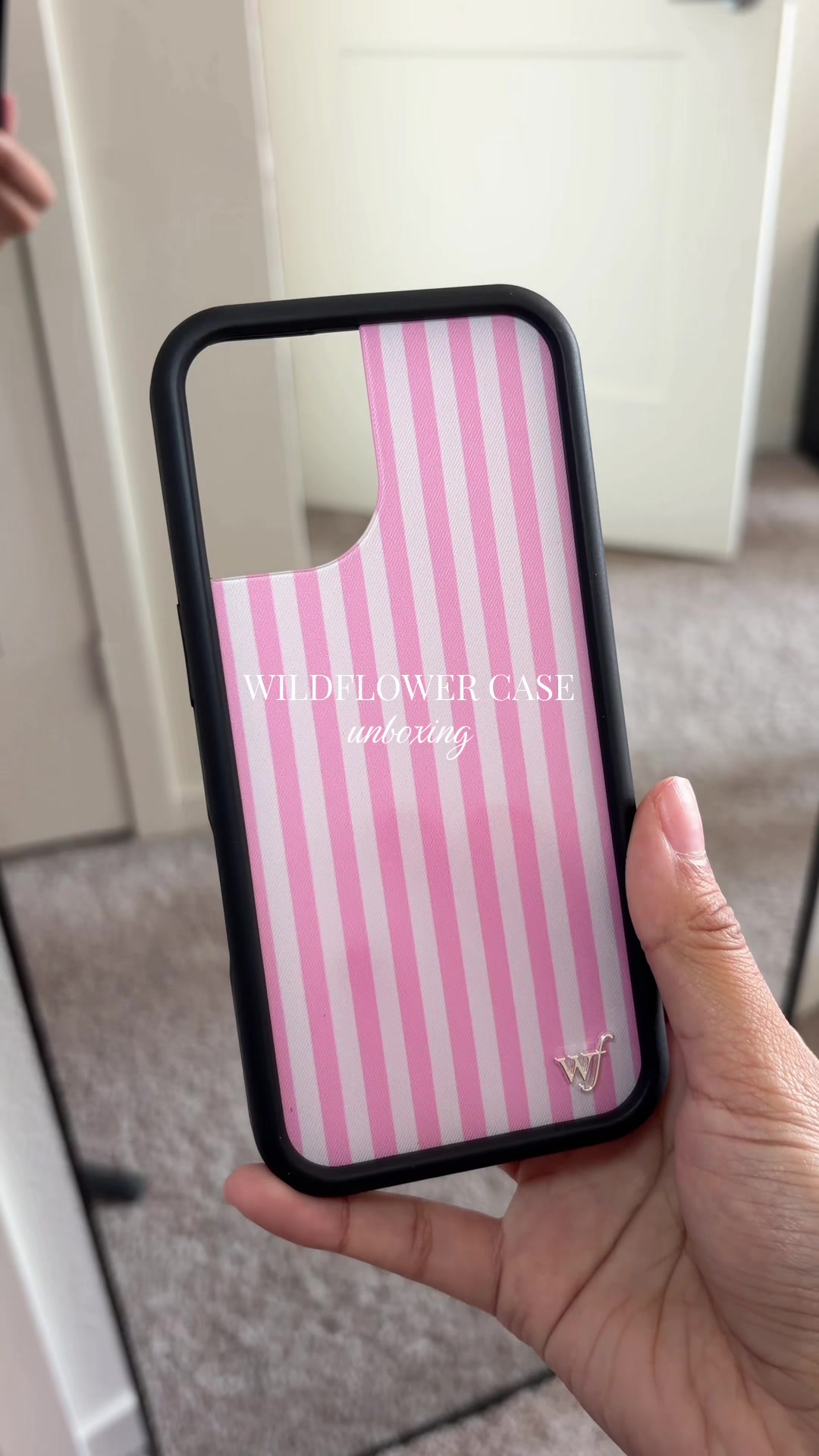 TikTok post by @andrea.alv_ for Wildflower Cases. Caption reads: My new striped phone case🪽💗 @Wildflower Cases....