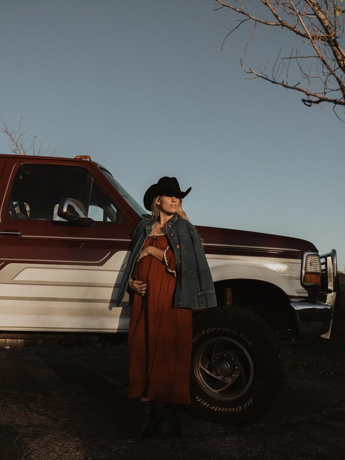Instagram post by @emoryhall for Christy Dawn. Caption reads: in full bloom 🌾 wearing the @christydawn marissa....