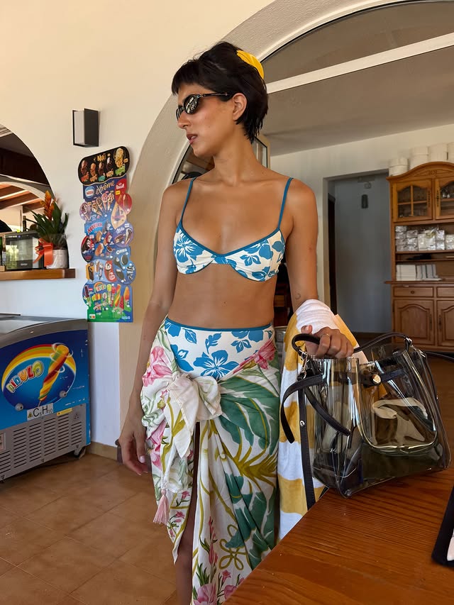 Instagram post by @caterina.iannolo for Tory Burch. Caption reads: idk why but cala xarraca sounds funny, doesn’t it?....