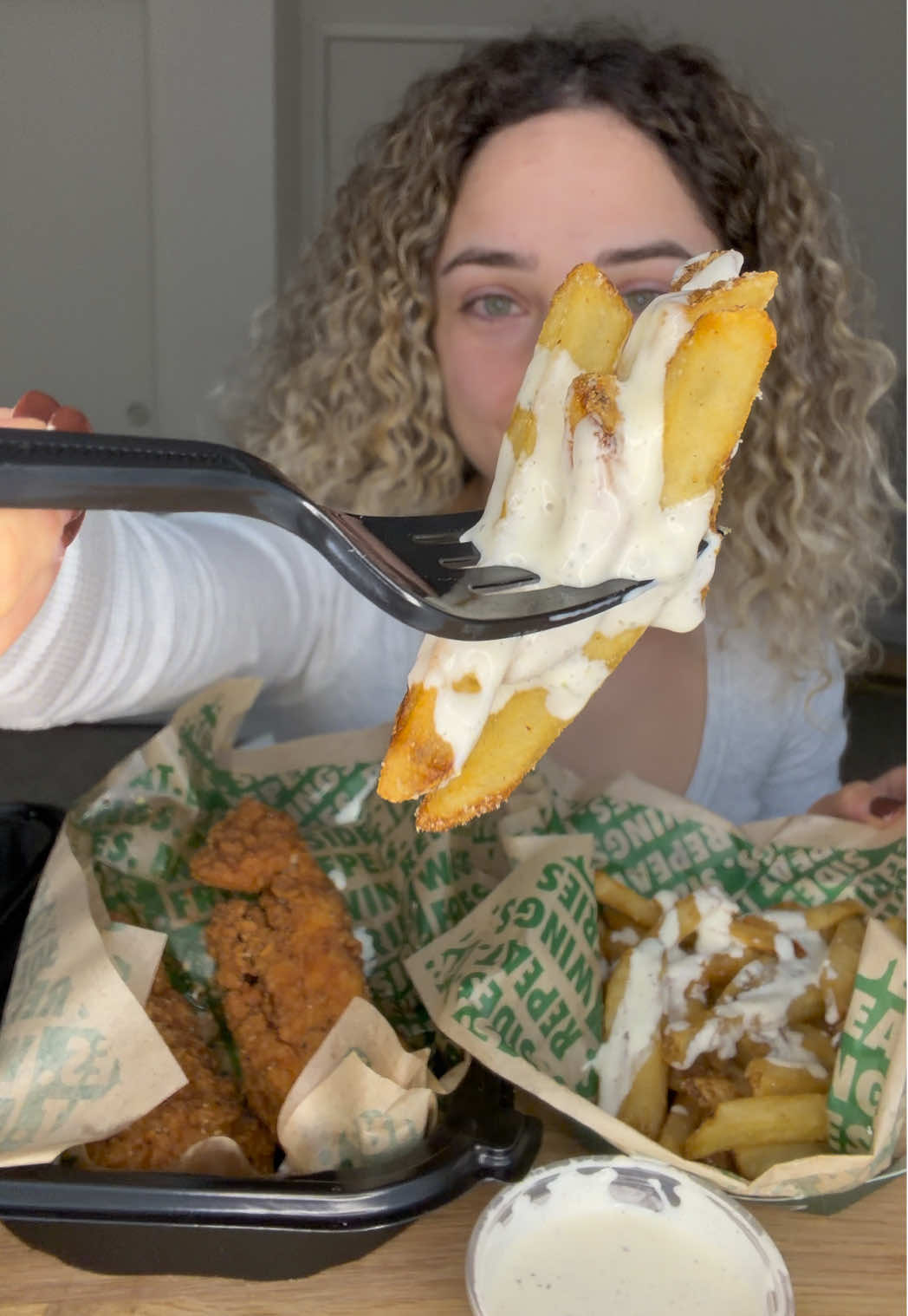 TikTok post by @marika.eats for Wingstop. Caption reads: @Wingstop mukbang for the first time!🍗🍟....