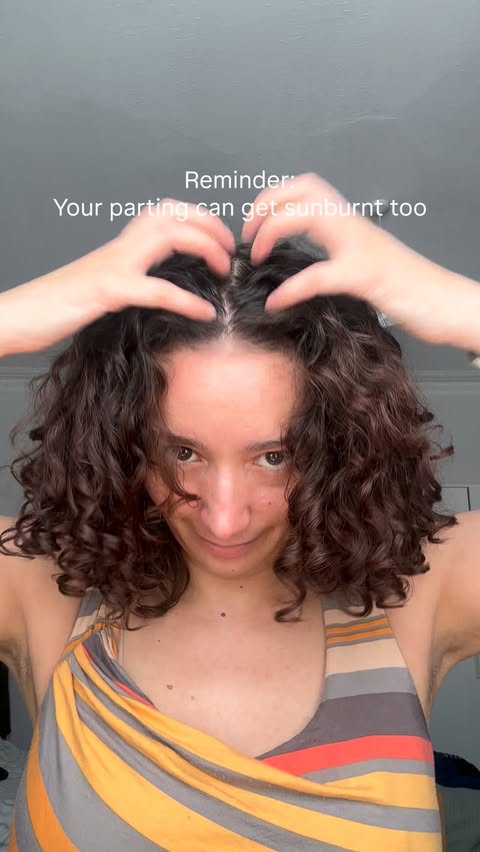 Instagram post by @curlsbythecoast for Hawaiian Tropic. Caption reads: Trying the @hawaiiantropic / @hawaiiantropic_eu....