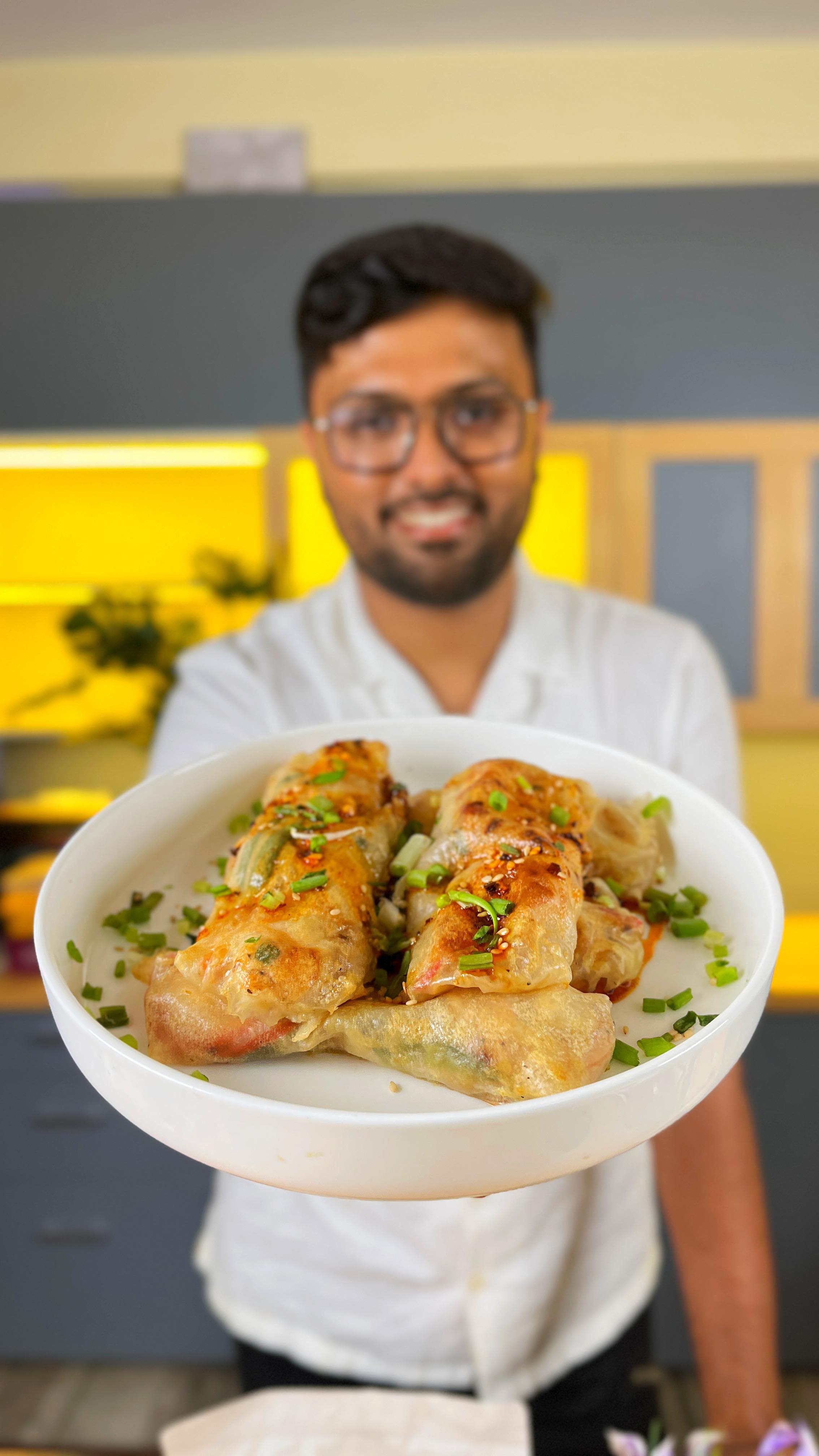 Instagram post by @the_bong_gastronomist for freshtohome. Caption reads: Prawn Spring rolls but these are not fried and....