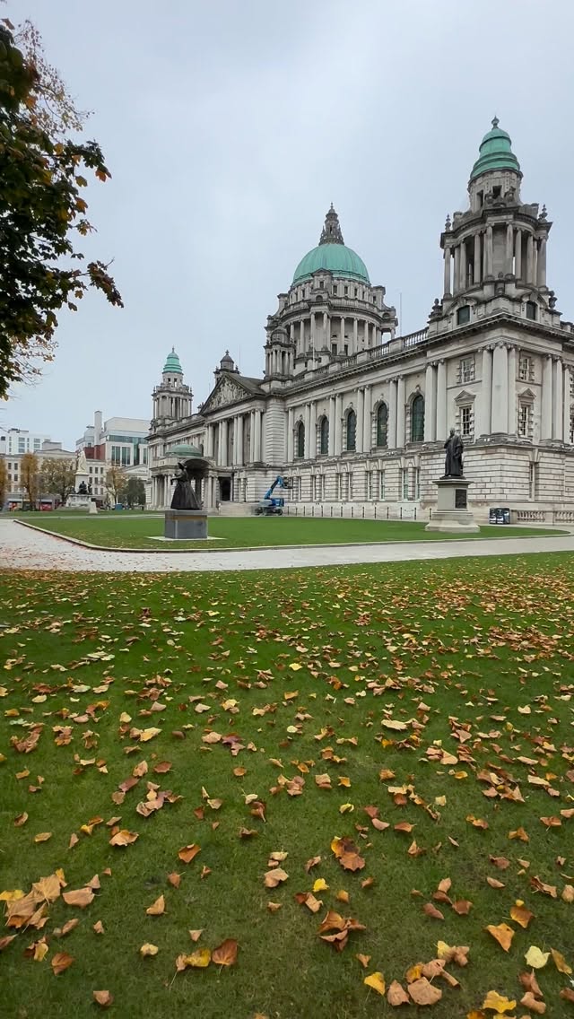 Instagram post by @travellernorthernireland for Discover Northern Ireland. Caption reads: 🍂 Belfast City Hall today 🧡🍁
.
.
#belfast....