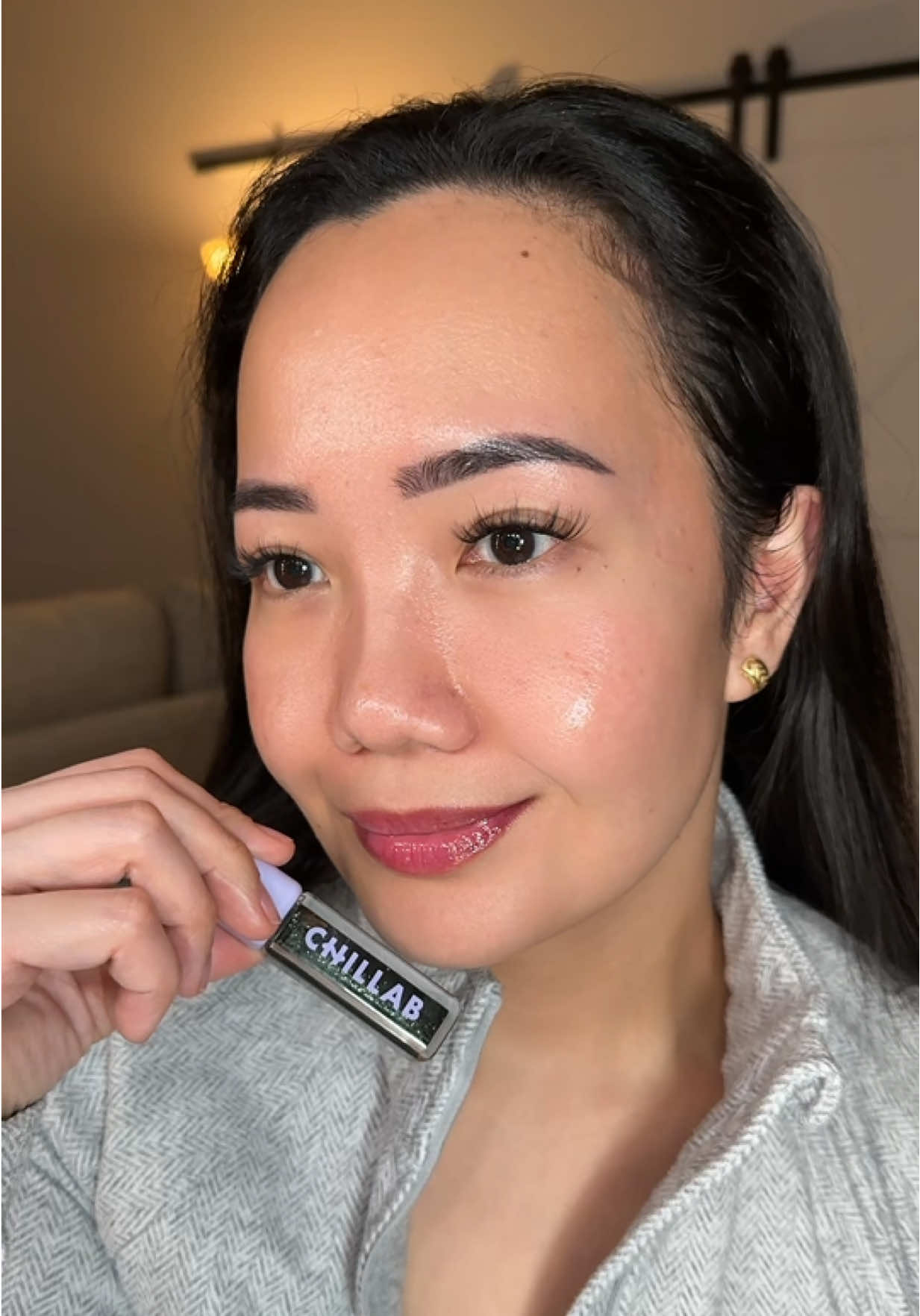 TikTok post by @ladybuttercakes for Chillab. Caption reads: Tried the @CHILLAB Magic Black Plumping Lip Oil 💋....