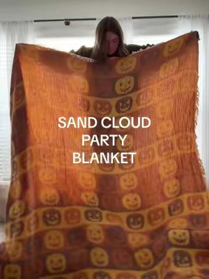 TikTok post by @itslivvickers for Sand Cloud. Caption reads: [...] 🎃👻 like WHERE has this been?! @Sand Cloud....