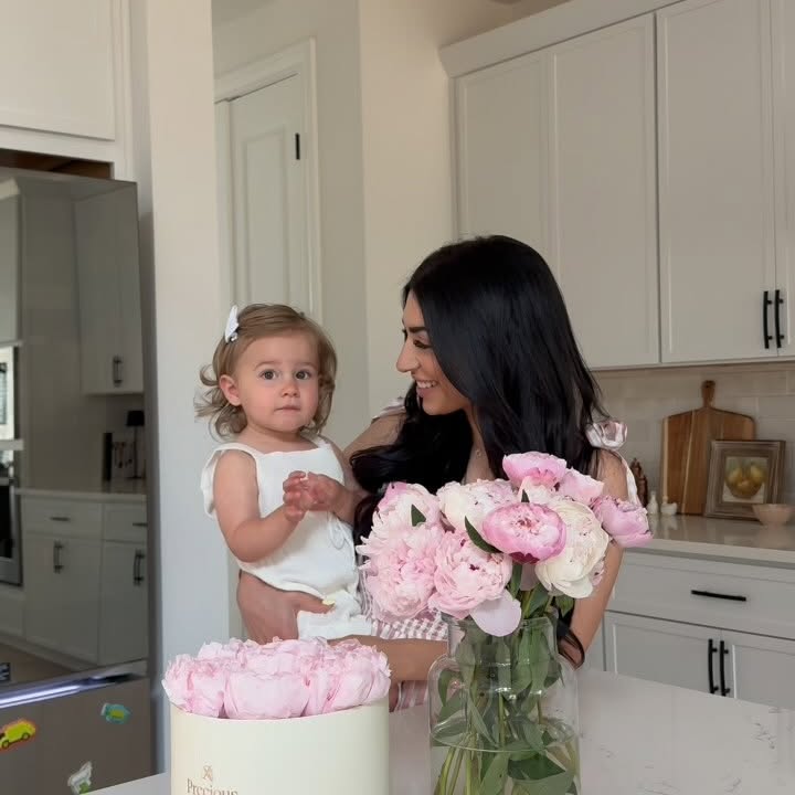 Instagram post by @nadia for 1800Flowers. Caption reads: One of the things I treasure most about motherhood....