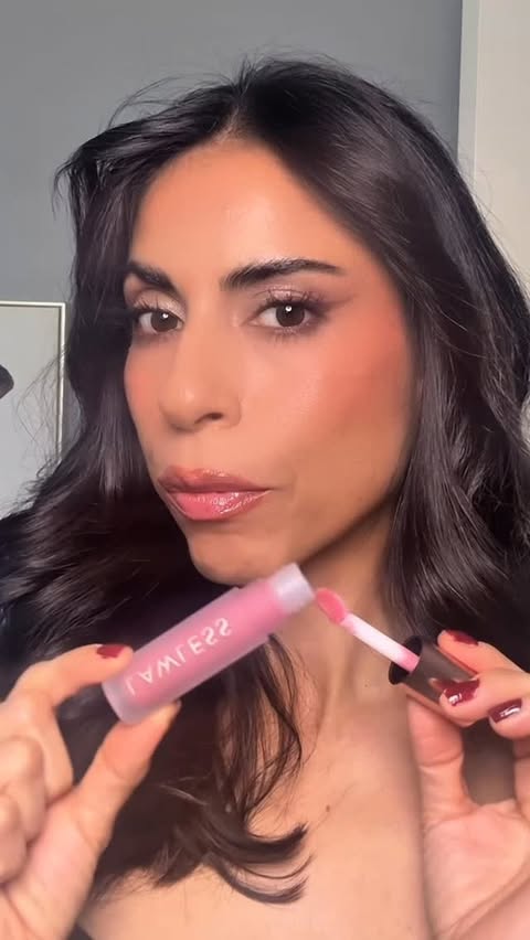 Instagram post by @beautybubble0326 for LAWLESS. Caption reads: [...] LIP-PLUMPING LINE-SMOOTHING GLOSS - @lawless....