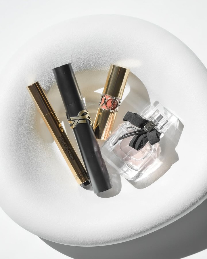 Instagram post by @ausradun for eCosmetics. Caption reads: alluring and cozy Mon Paris edp by Ysl Beauty 🩷✨....