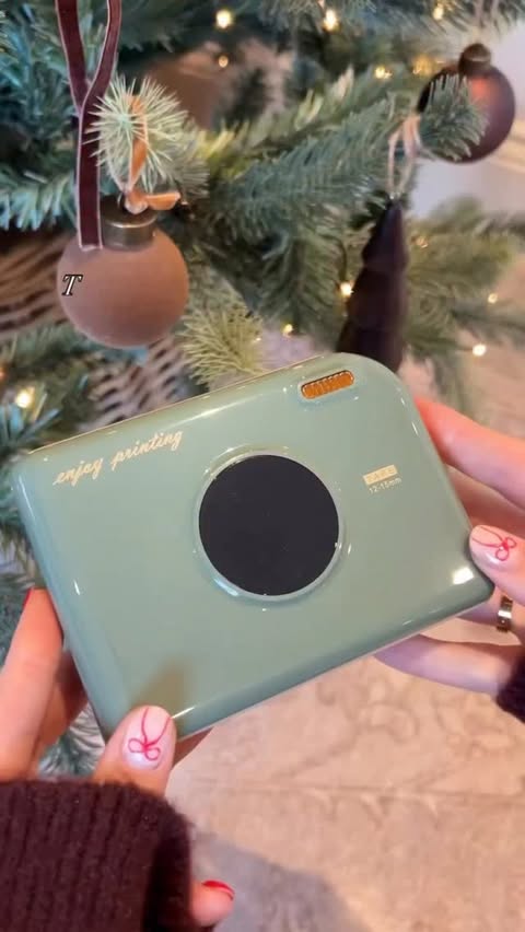 Instagram post by @littlehomecomforts for Phomemo. Caption reads: [...] adorable is this Retro Camera inspired....