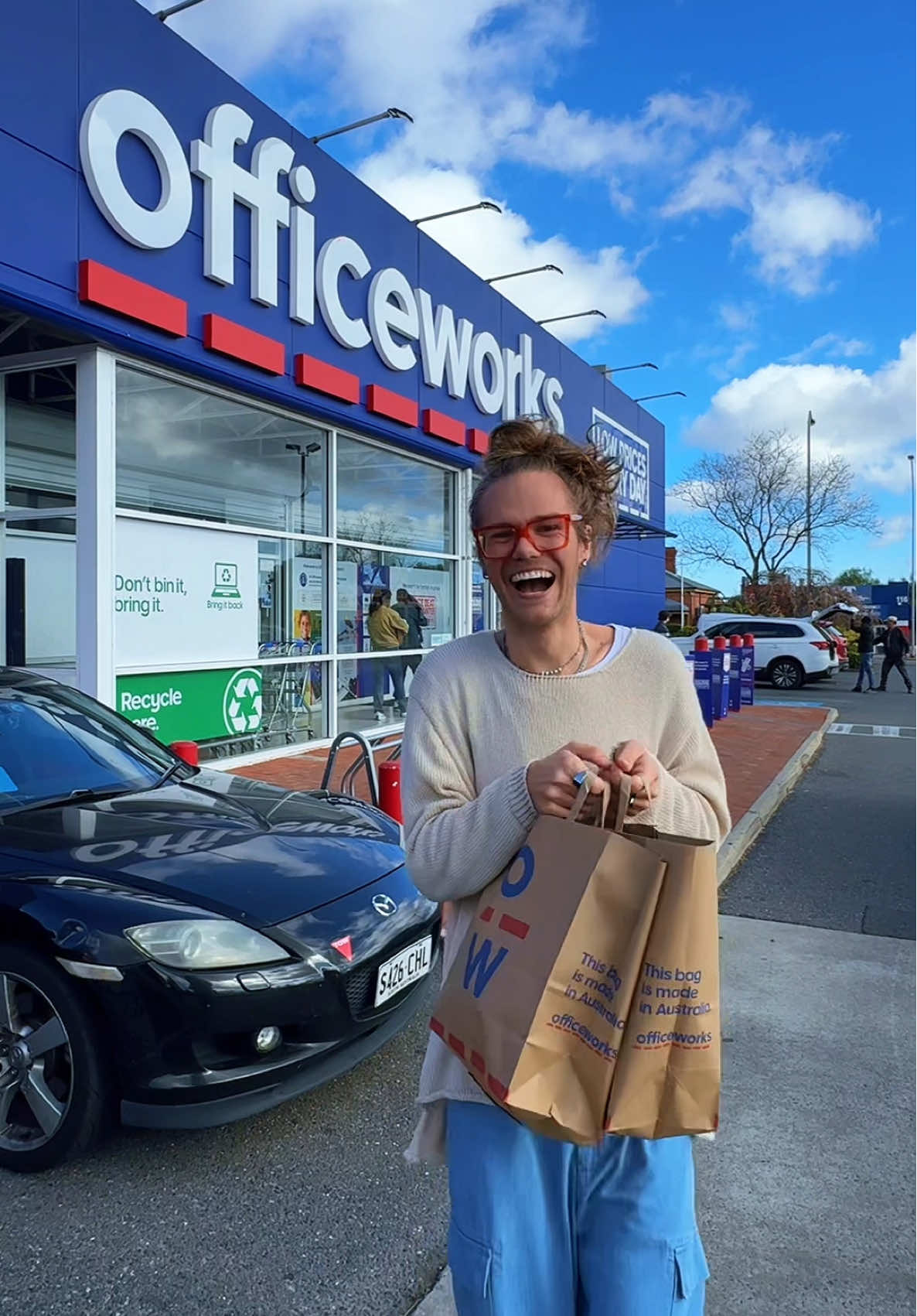 TikTok post by @iam.mrluke for Officeworks. Caption reads: Spending a little time these holidays stocking up....