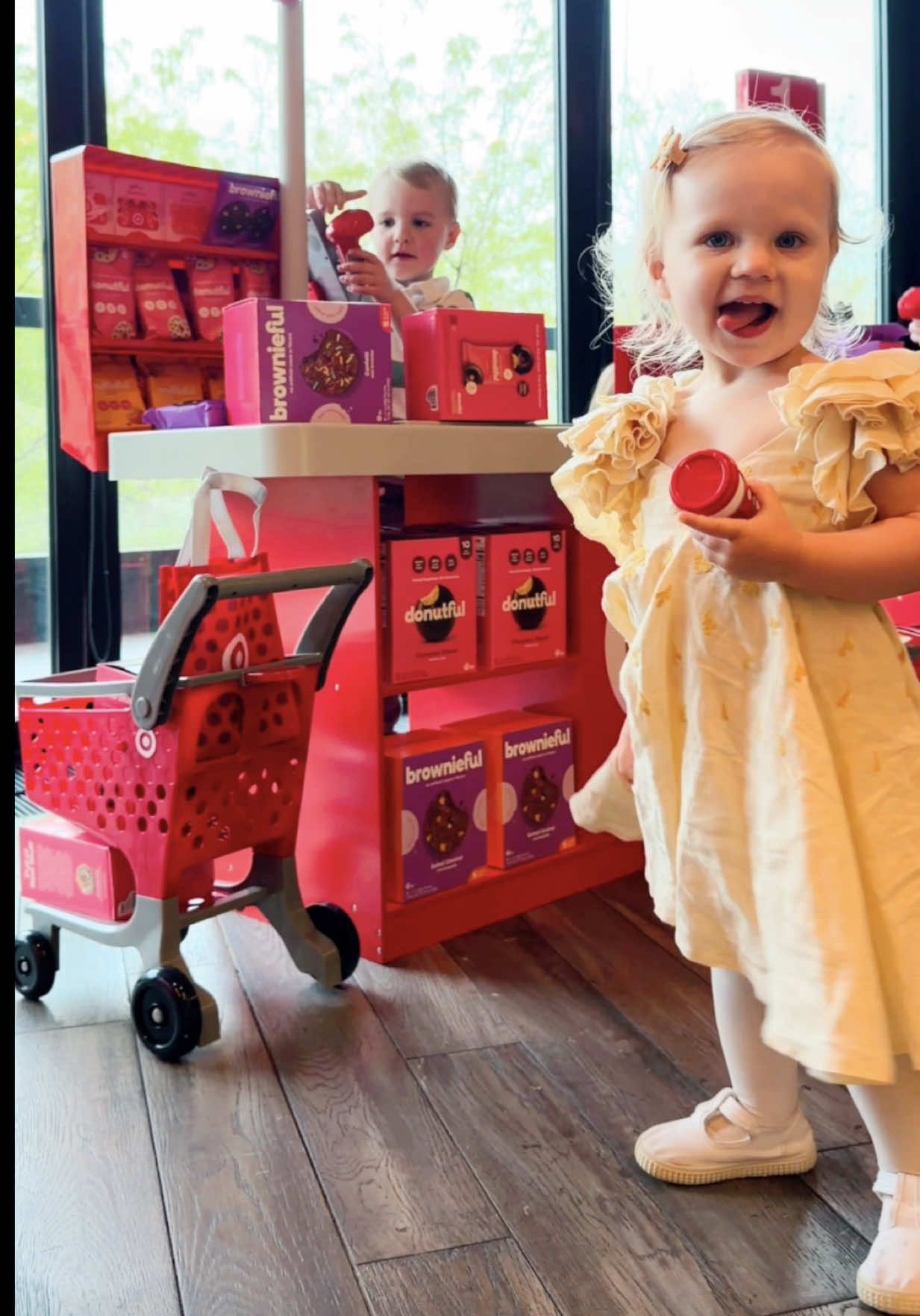 TikTok post by @ashleyarcement for Donutful. Caption reads: Welcome to a day in the life of a toddler....