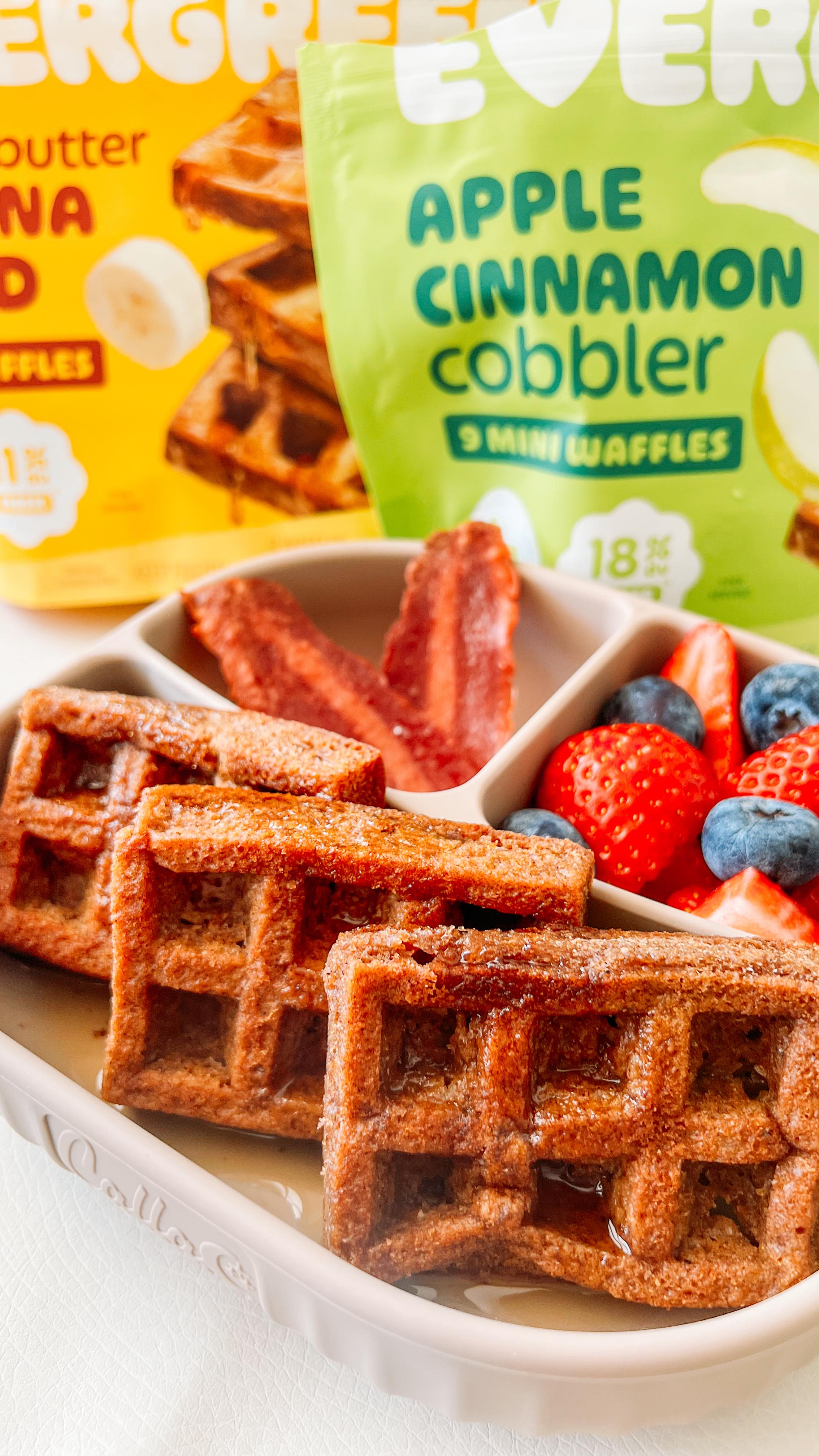 Instagram post by @raising_littlekings for Eat Evergreen. Caption reads: @eatevergreen waffles are now available at....