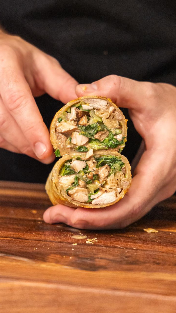 Instagram post by @bengingi for HexClad. Caption reads: Grate parm straight onto the pan, roll your wrap....