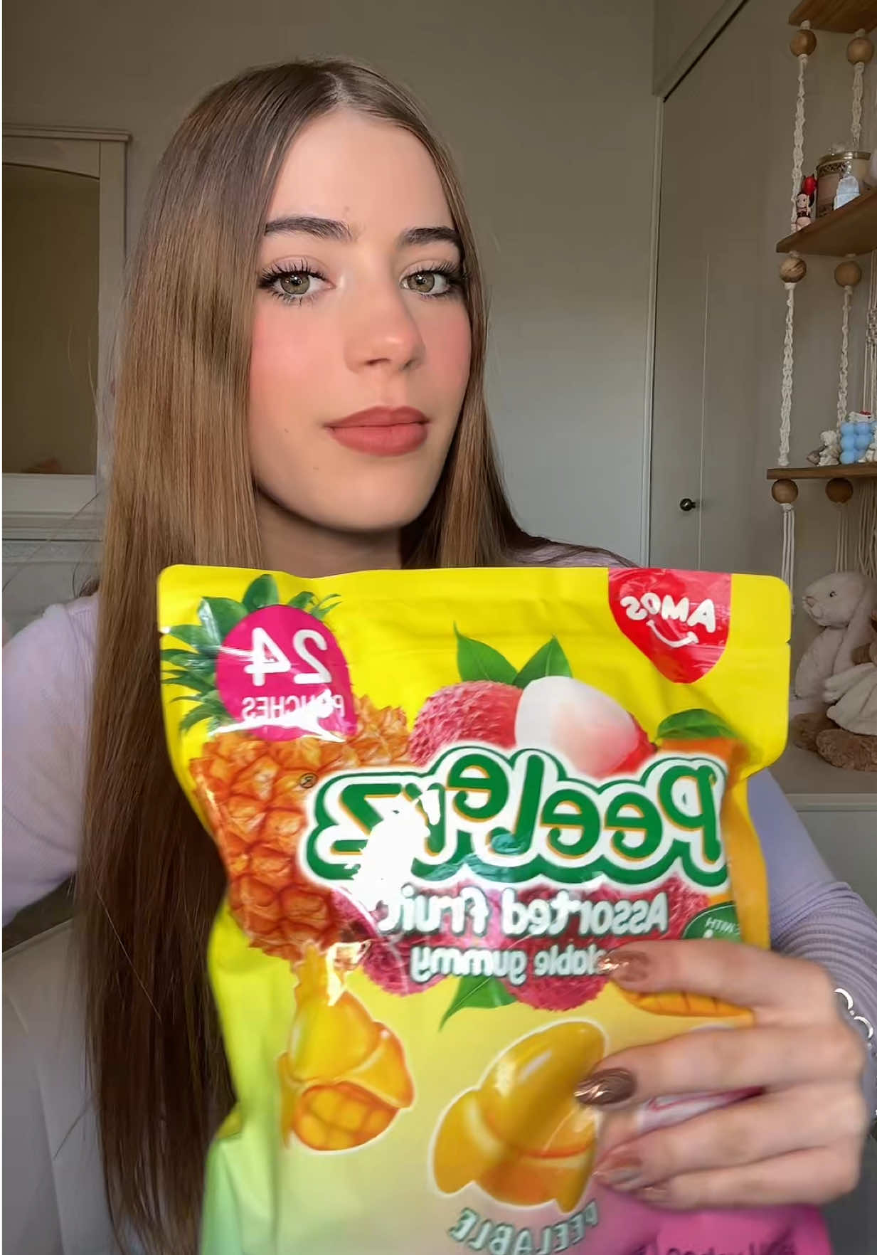 TikTok post by @vickyoffishal for Amos Sweets. Caption reads: I LOVE THE NEW FLAVORS 🥭🍍@Amos Sweets....