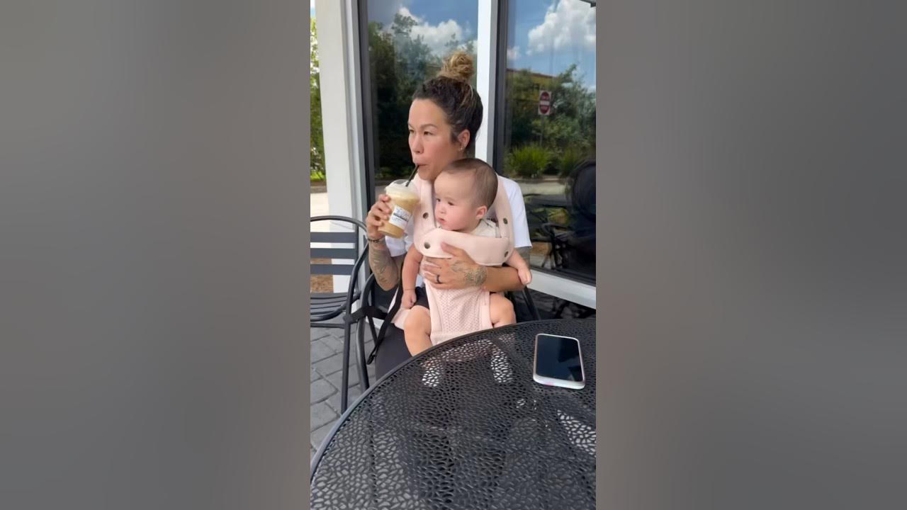 YouTube post by @SiaCooper for Momcozy. Caption reads: [...] Carrier has made it all so much easier.....