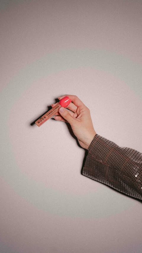 Instagram post by @domiziacastagnini for NUXE. Caption reads: #Adv @nuxeitalia Lip Serum Very Rose Nuxe: taking....
