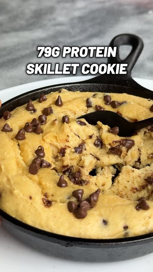 Instagram post by @michaelkory for PBfit. Caption reads: 🍪 79g Protein Skillet Chocolate Chip Cookie 🍪🤤....