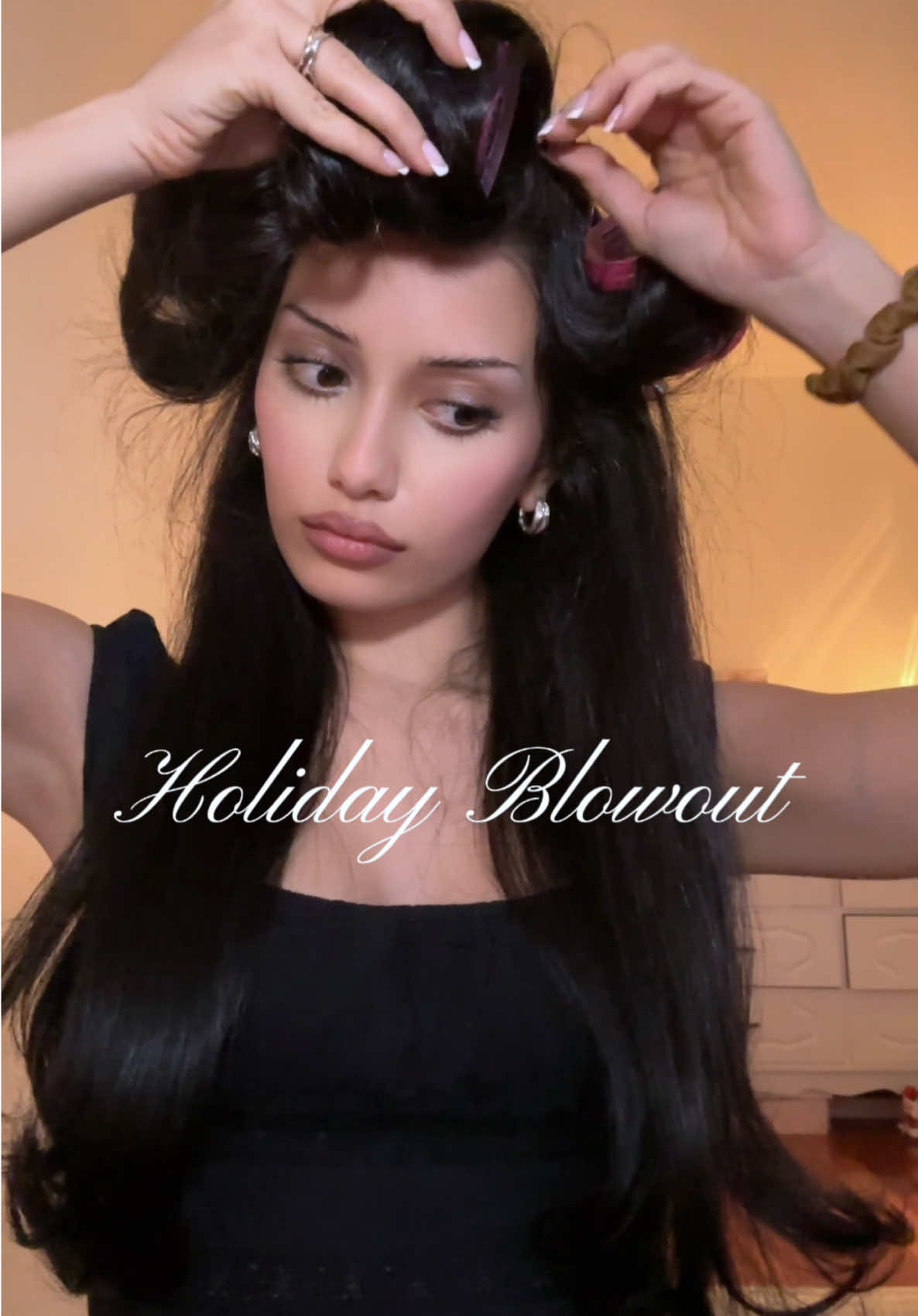 TikTok post by @skunkbabe for OLAPLEX. Caption reads: there’s nothing like a holiday blowout. @Olaplex....