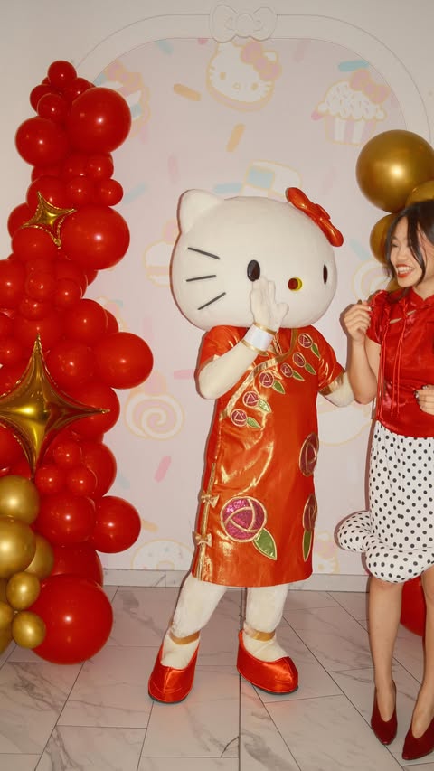 Instagram post by @juliaakong for Hello Kitty. Caption reads: [...] next lunar new year meet & greet with....
