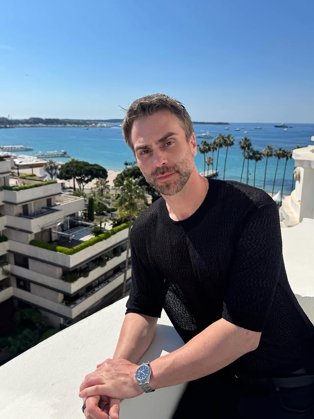 Instagram post by @georgisandev for AMOUAGE. Caption reads: [...] #georgisandev #CannesFilmFestival....