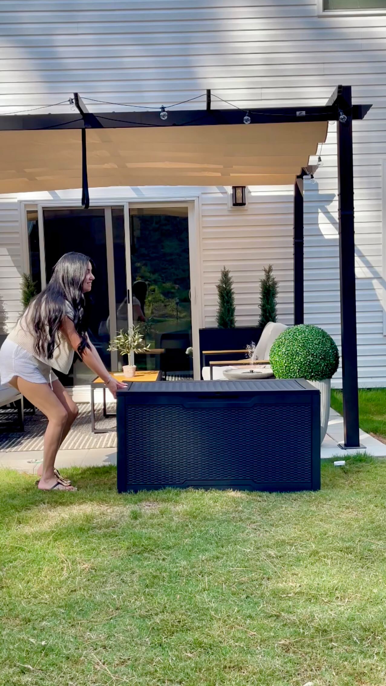 Instagram post by @jeanny.myneutralhome for YITAHOME. Caption reads: This 100-gallon outdoor deck box from @yitahome.us....