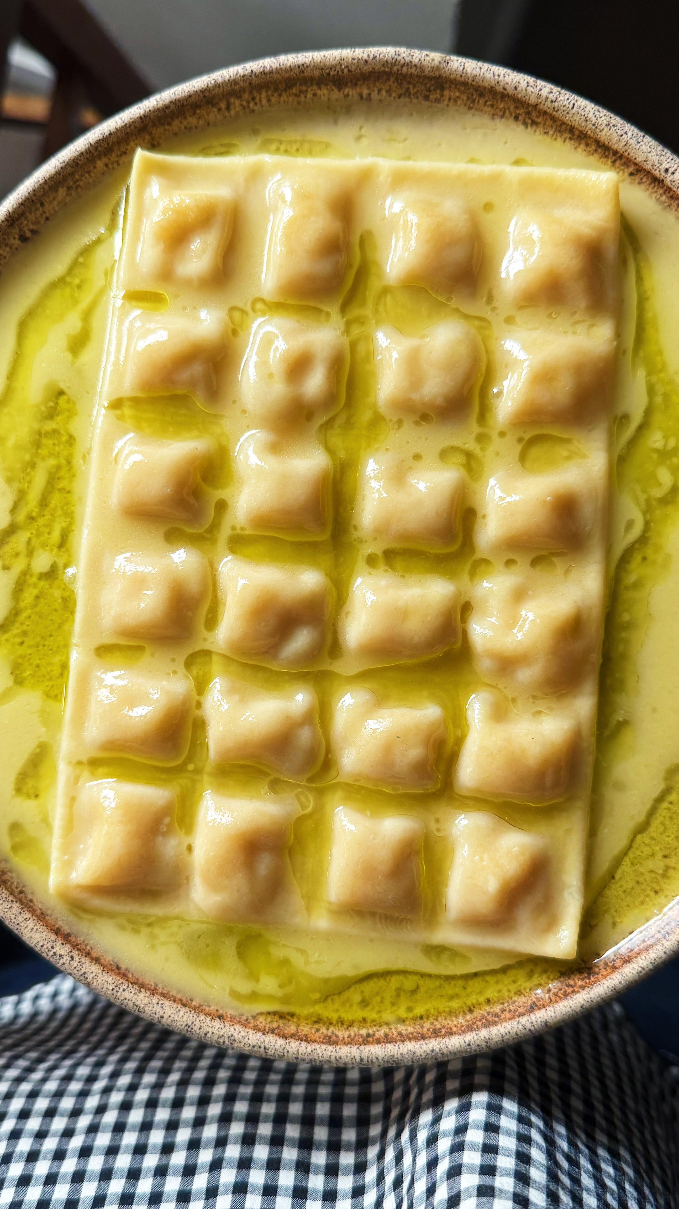 Instagram post by @carolinagelen for NYT Cooking. Caption reads: FRENCH RAVIOLI: RAVIOLES DU DAUPHINÉ — these....