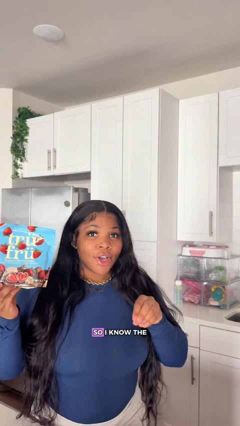 Instagram post by @itskailaaax for Tru Fru. Caption reads: [...] in milk chocolate? i think YES!🫶🏽 @trufru....