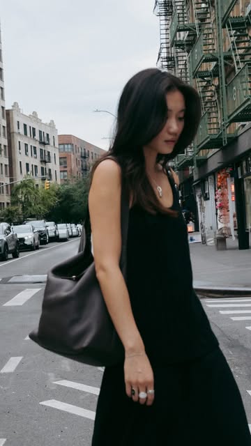 Instagram post by @vivianyrl for LONGCHAMP. Caption reads: caught in motion with my @longchamp cadence bag....