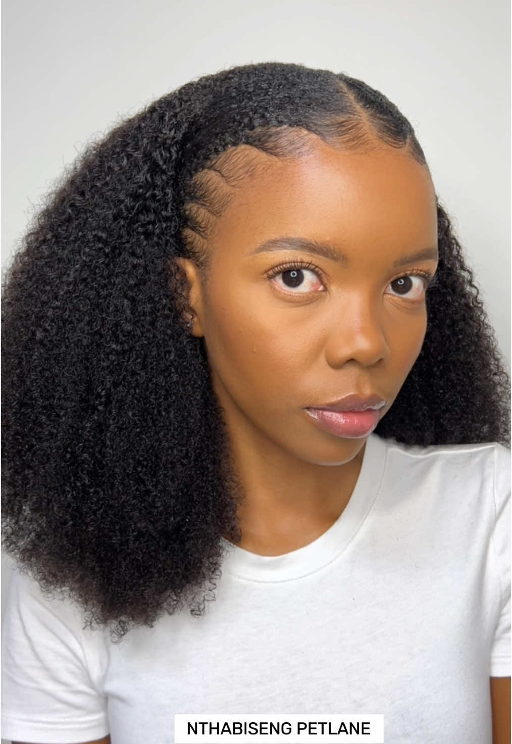 TikTok post by @nthabisengpetlane for Curlsqueen. Caption reads: @curlsqueen Clip ins will never cause you any....