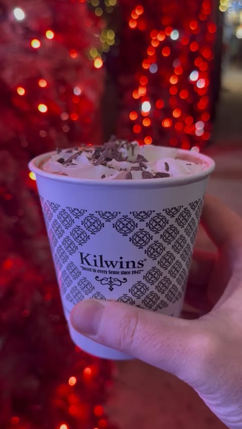 Instagram post by @thegrapevineedit for Kilwins. Caption reads: 🍫✨ If you’re wandering Main Street this season....