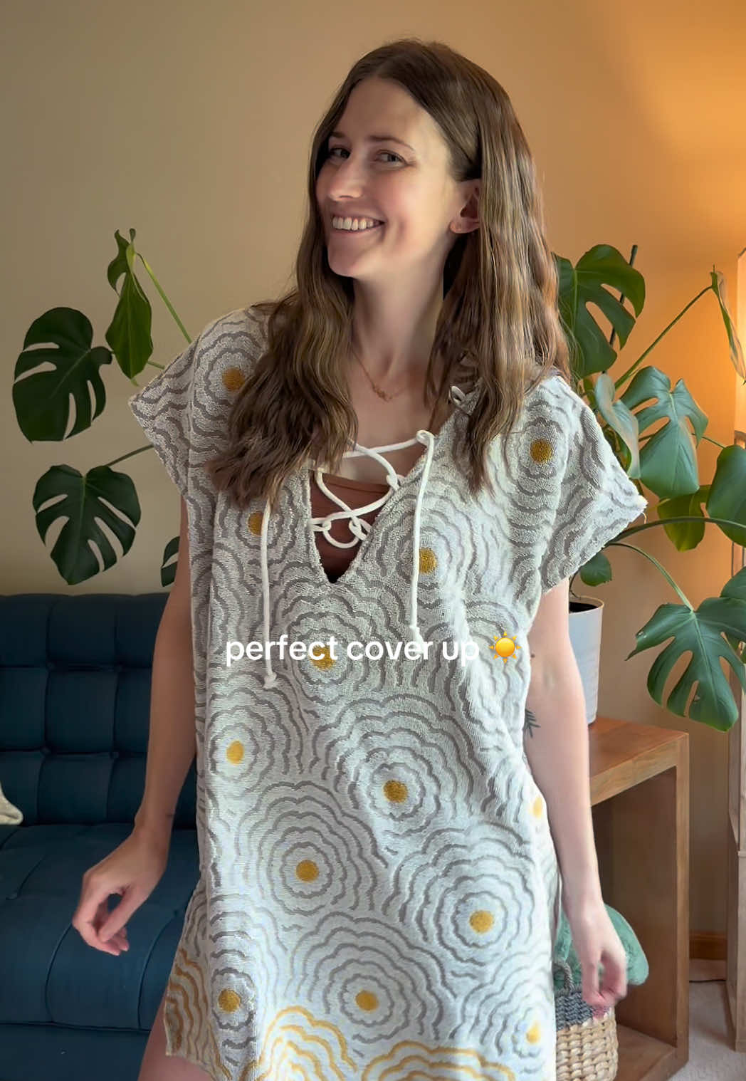 TikTok post by @daybydaywithkayla for Sand Cloud. Caption reads: This @Sand Cloud cover up is finally back in stock....