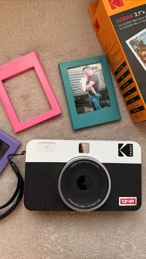 Instagram post by @brothers_on_the_move_ for Kodak Photo Printer. Caption reads: [...] to life, one photo at a time 🌿....