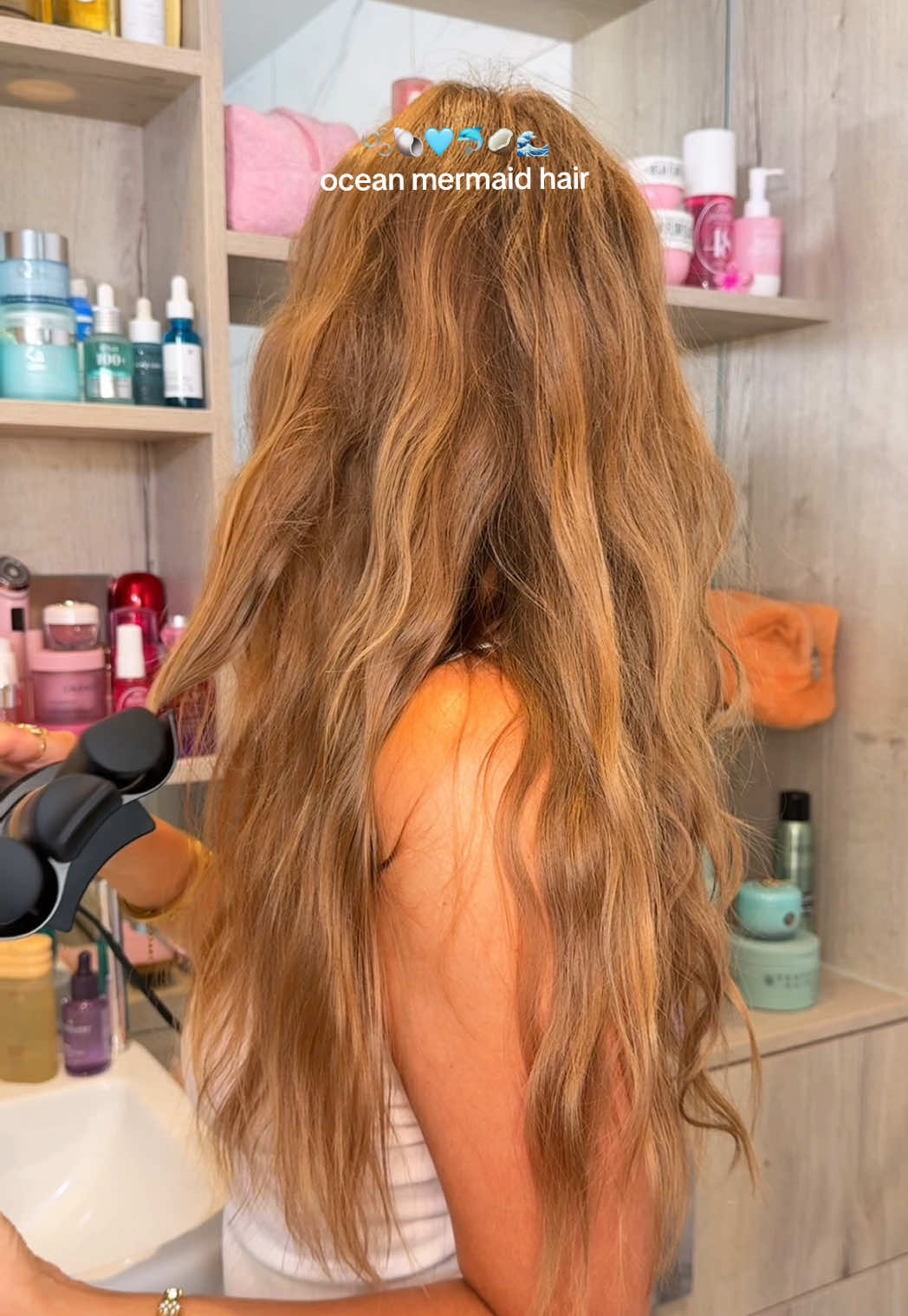 TikTok post by @by.emmaleah for Living Proof. Caption reads: [...] reedle shot hair ampoule* @Living Proof,....