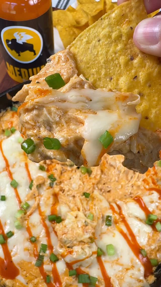 Instagram post by @cookinginthemidwest for Buffalo Wild Wings. Caption reads: #sponsored Buffalo Chicken Dip made with @bwwings....
