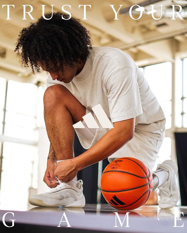 Instagram post by an influencer for adidas Basketball. Caption reads: @spidadmitchell wasn’t playing around with these🔥....