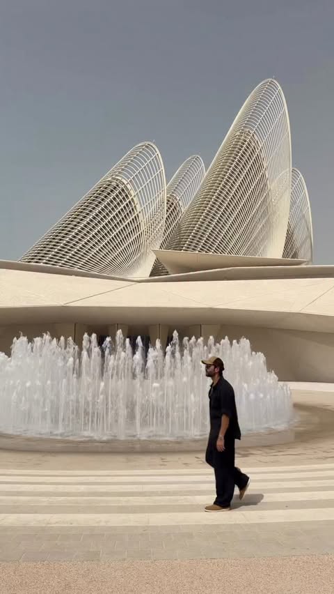 Instagram post by @rahullsharma for Experience Abu Dhabi. Caption reads: An architectural poem written in sand, light, and....