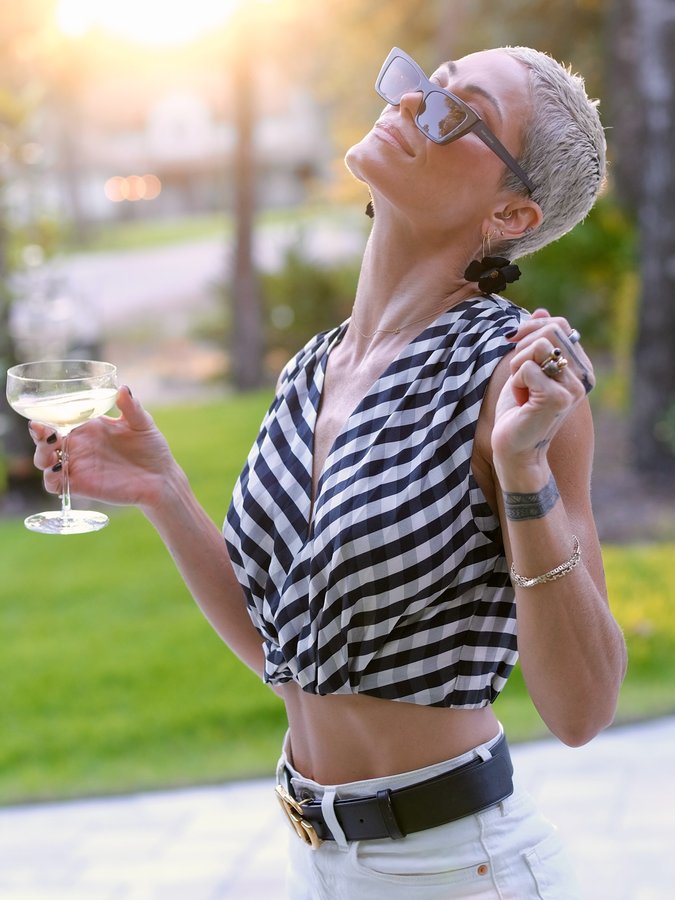 Instagram post by @katiemartinstudio for Rent the Runway. Caption reads: Hiiiiiii 👋 It’s me. Slowly creeping back onto the....