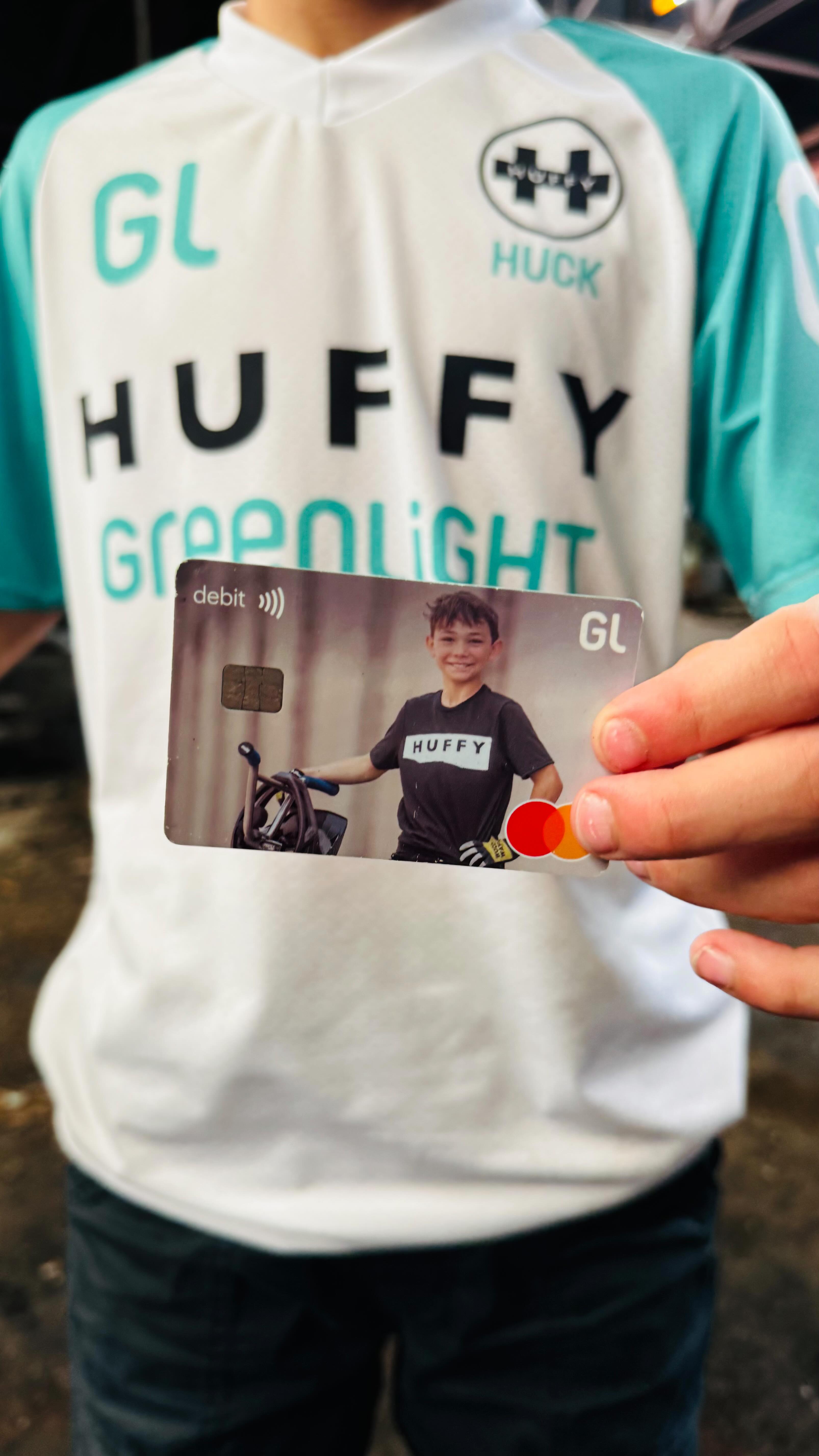 Instagram post by @huckkurinsky for Greenlight. Caption reads: My @greenlightcard debit card is making life here....