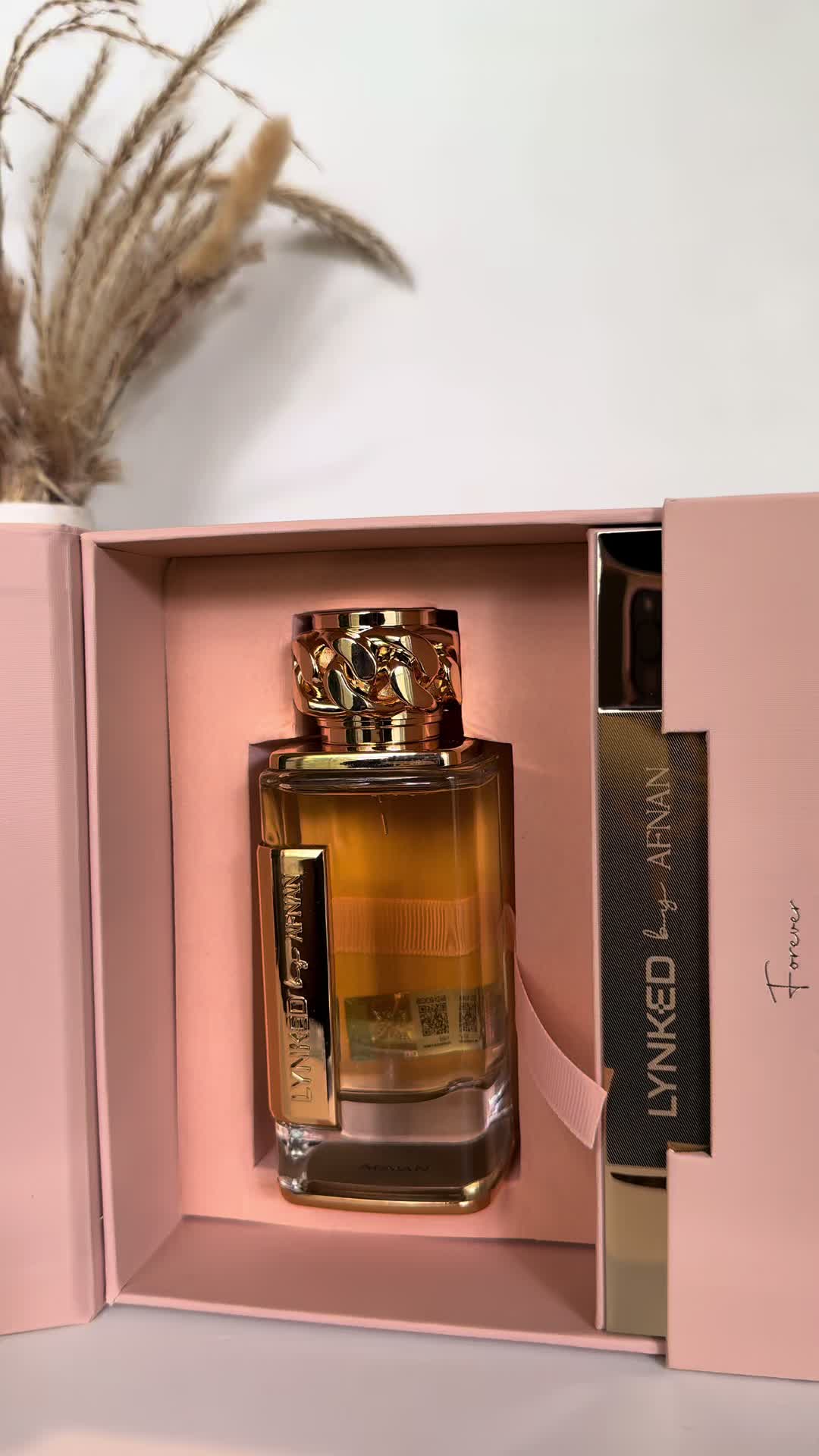 TikTok post by @rebeccathomas805 for Afnan Perfumes. Caption reads: Afnan Lynked Forever Gold Perfume✨ @Afnan Perfumes....
