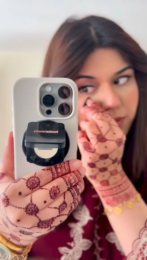 Instagram post by @mahnoor_malik17 for Huda Beauty. Caption reads: Final touch ups on the go! @hudabeauty easy bake....