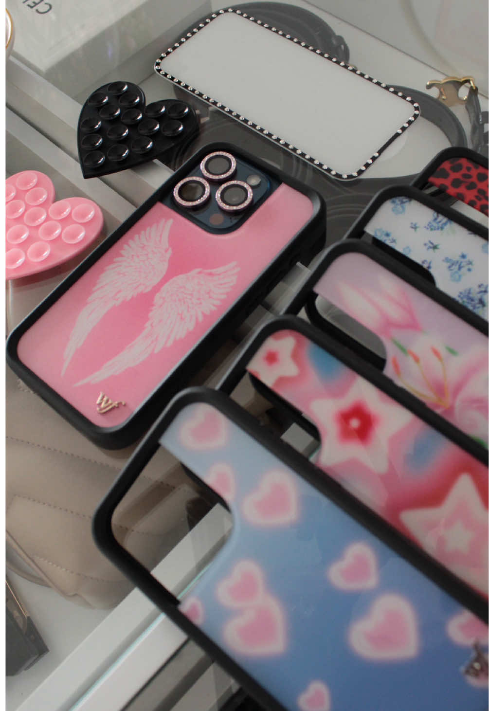 TikTok post by @liz.dexter for Wildflower Cases. Caption reads: I have @Wildflower Cases obsession 🎀✨ [...].