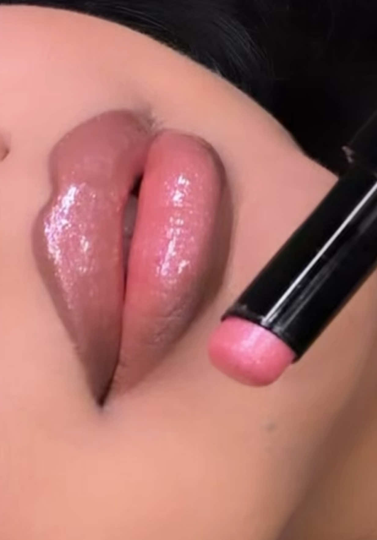 TikTok post by @eveysolorio for GETSTONNED. Caption reads: Slip 💕✨ @GetStonned #lipbalm #glitter.