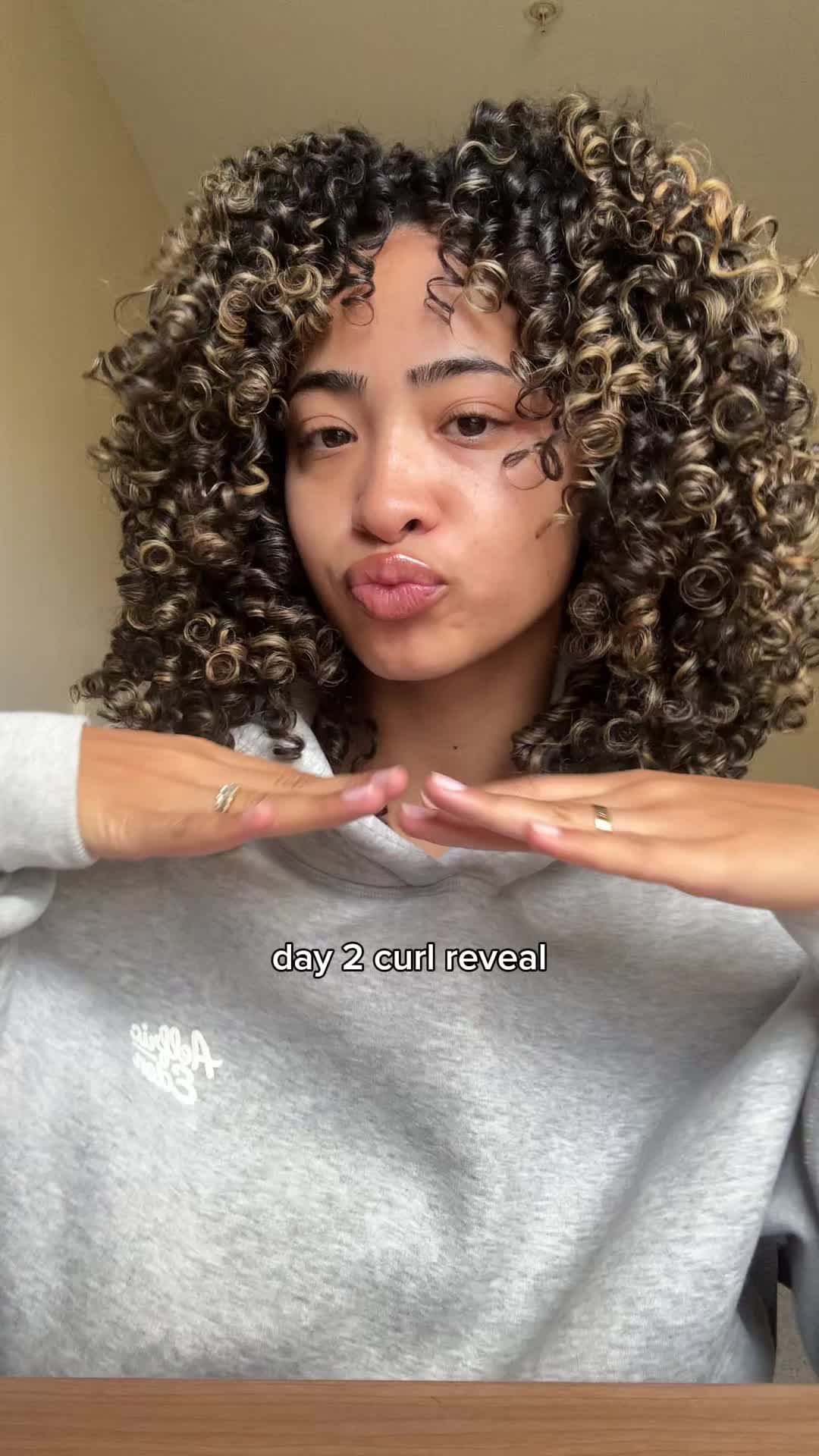 TikTok post by @isaa.javierr for OLAPLEX. Caption reads: @Olaplex #curlyhair .
