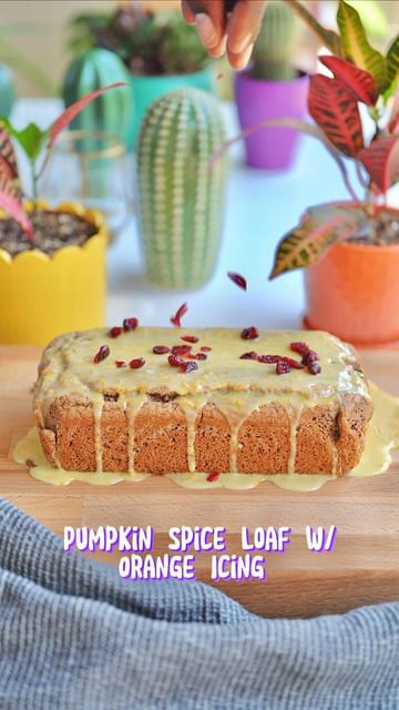 Instagram post by @turnipvegan for Partake Foods. Caption reads: Pumpkin Spice Loaf w/ Orange Icing and Dried....