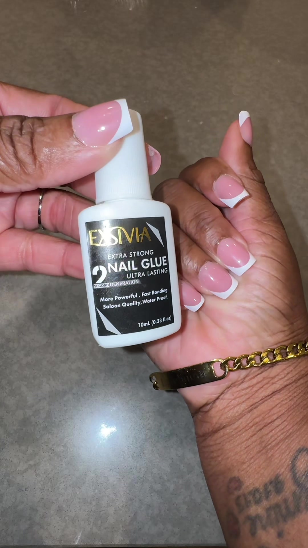 TikTok post by @fearlesslyn for Exsivia. Caption reads: [...] far the best nail glue I’ve come across....