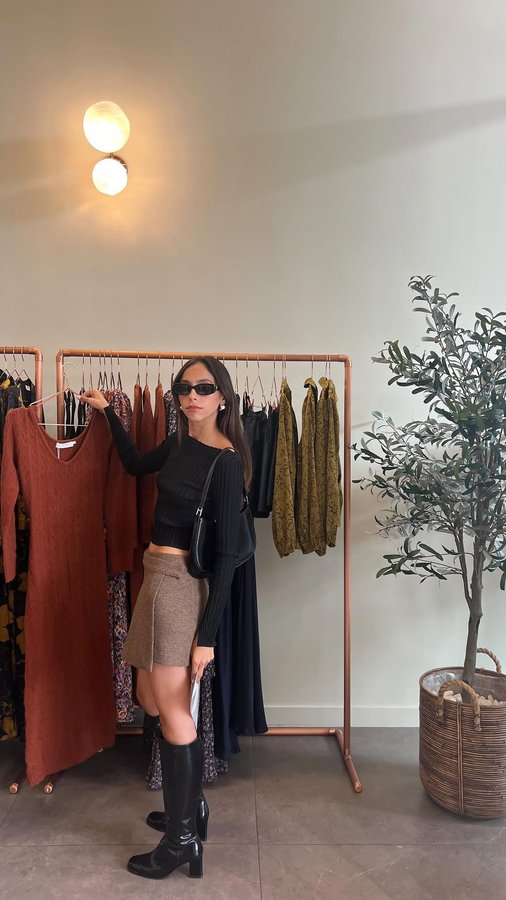 Instagram post by @beccaxacosta for ASTR The Label. Caption reads: Come with me to visit @astrthelabel’s new store at....