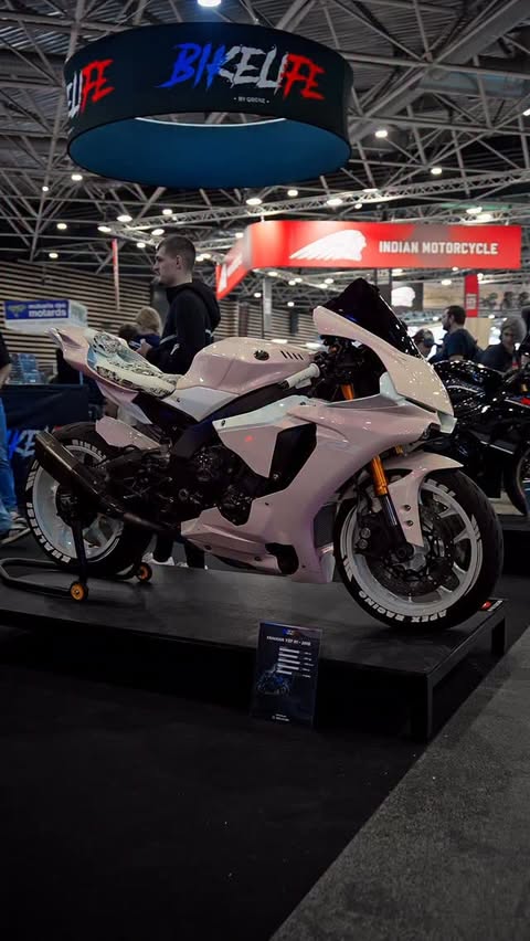 Instagram post by @kellylrh for Cardo Systems. Caption reads: [...] @alpinestars 📱 — @quadlockmoto 🎶 —....