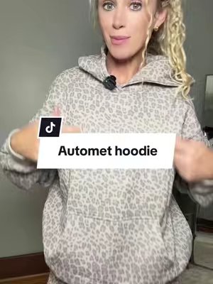TikTok post by @gold3nlox for Automet. Caption reads: the coziest campfire hoodie 🍂 🪵🔥 @AUTOMET....