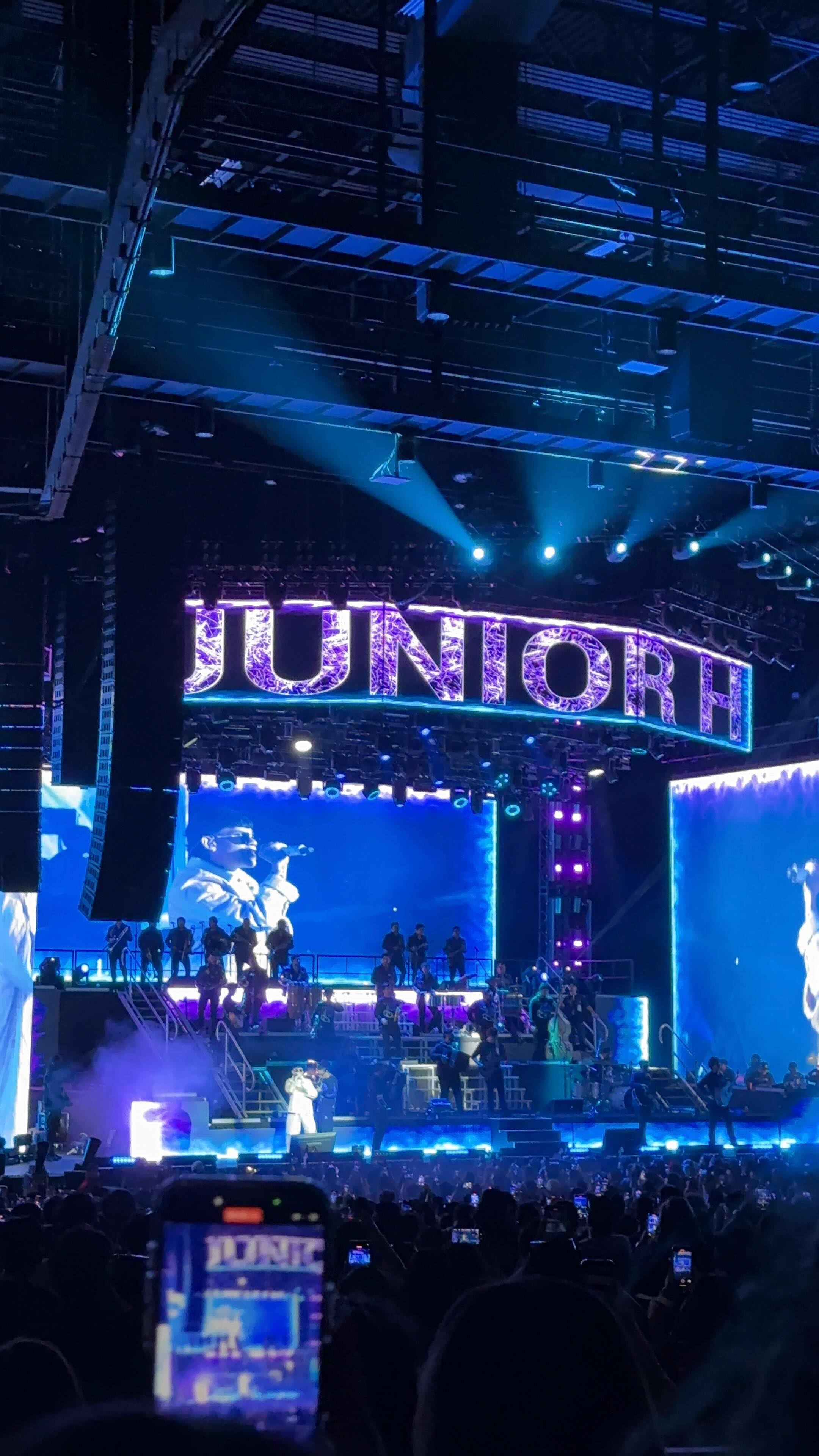 Instagram post by @neidy_espinosa for SeatGeek. Caption reads: Junior H live = unreal!!! All thanks to....