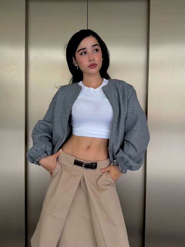 Instagram post by @apj.bella for COS. Caption reads: COS you can never go wrong with long skirts [...].